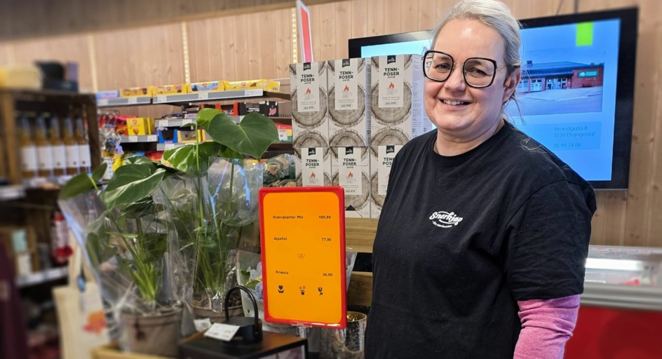 Kjøpmann foran blomst